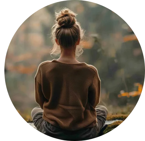 Woman sitting down meditating